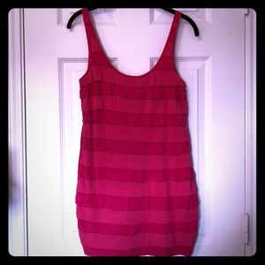 Long pink ruffled jumper.